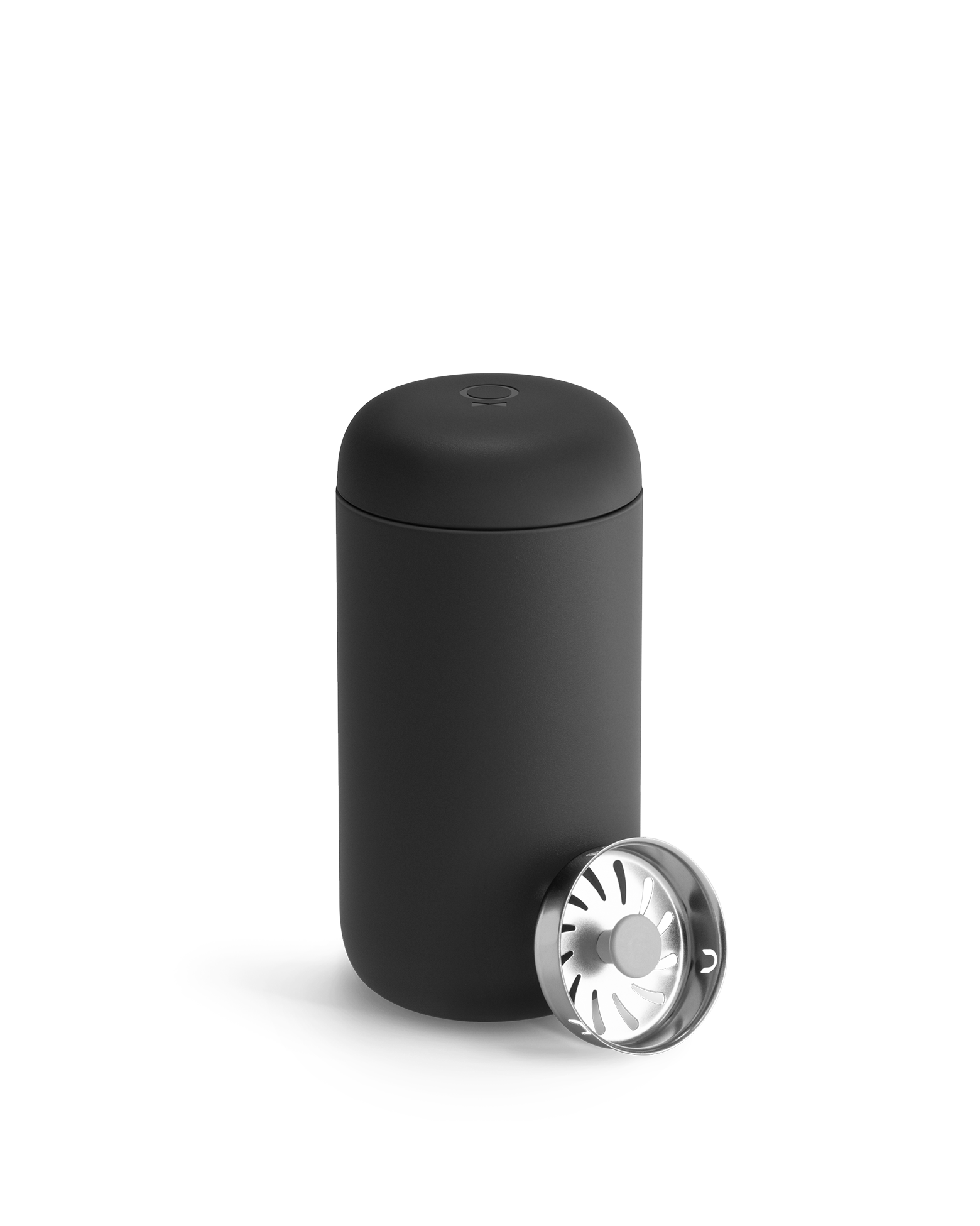 Matte black 12 oz Fellow Carter Move Mug with its splash guard beside it